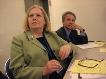 School board trustees sitting in a meeting room